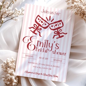 May include: A bridal shower invitation with a pink and white striped design. The invitation features red text and graphics, including two champagne glasses and the words "Emily's Bridal Shower". Details include the date, time, and RSVP information.