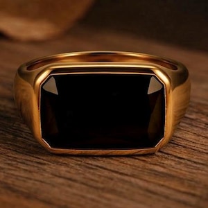 Anello a sigillo con onice nera taglio smeraldo, incastonatura East West in argento sterling e oro