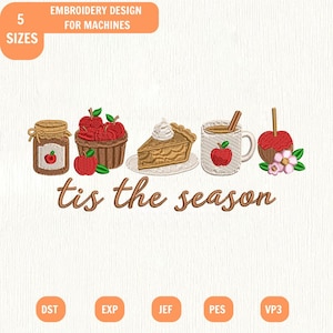 May include: An embroidery design for machines featuring a jar of apple jam, a basket of red apples, a slice of pie, a mug with a cinnamon stick, and a candy apple with flowers. The text reads 'tis the season' in brown script lettering.
