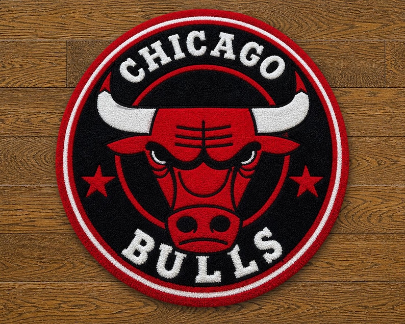 May include: Circular rug featuring the Chicago Bulls logo. The design includes a red bull head with white horns, set against a black background, and surrounded by a red and white border. The words "CHICAGO" and "BULLS" are in white.