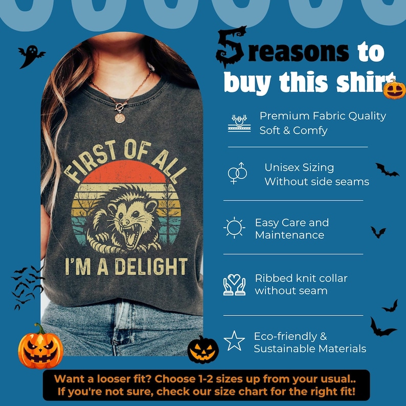 May include: A dark gray t-shirt featuring a vintage-style graphic of an opossum with the text "FIRST OF ALL I'M A DELIGHT" over a sunset background. The image includes a list of five product features and Halloween-themed icons like pumpkins and bats.