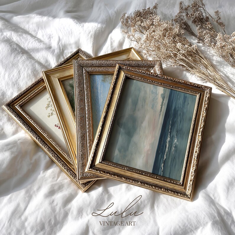 May include: A collection of vintage framed art pieces with ornate gold frames. The artwork within the frames features soft, muted colors, including blues, greens, and beige. The frames are arranged on a white, textured surface. The text "Lulu Vintage Art" is at the bottom.