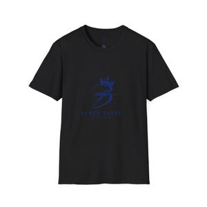 May include: Black t-shirt featuring a blue crown and a stylized "B" logo. The text "BLACK SHEEP" is below the logo. The shirt has a crew neck.