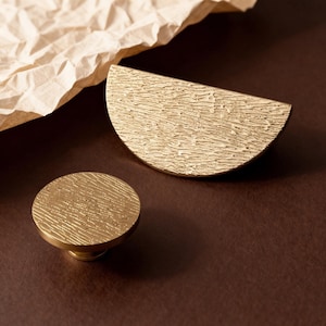 May include: A handmade wooden sign with the text "Welcome" in a playful font. The sign features a distressed white background and a dark stained wooden frame, perfect for a front door or entryway.