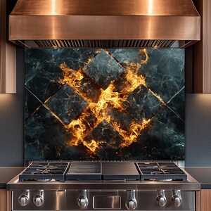 May include: A stainless steel gas range with a copper range hood. The backsplash features a dark marble design with a fiery orange and yellow pattern. Wooden cabinets are on either side of the range.