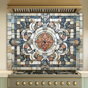 May include: A kitchen backsplash with a mosaic design. The backsplash features a central floral pattern in shades of red, orange, and brown, surrounded by a geometric arrangement of blue, grey, and beige tiles. The backsplash is installed above a gas cooker.