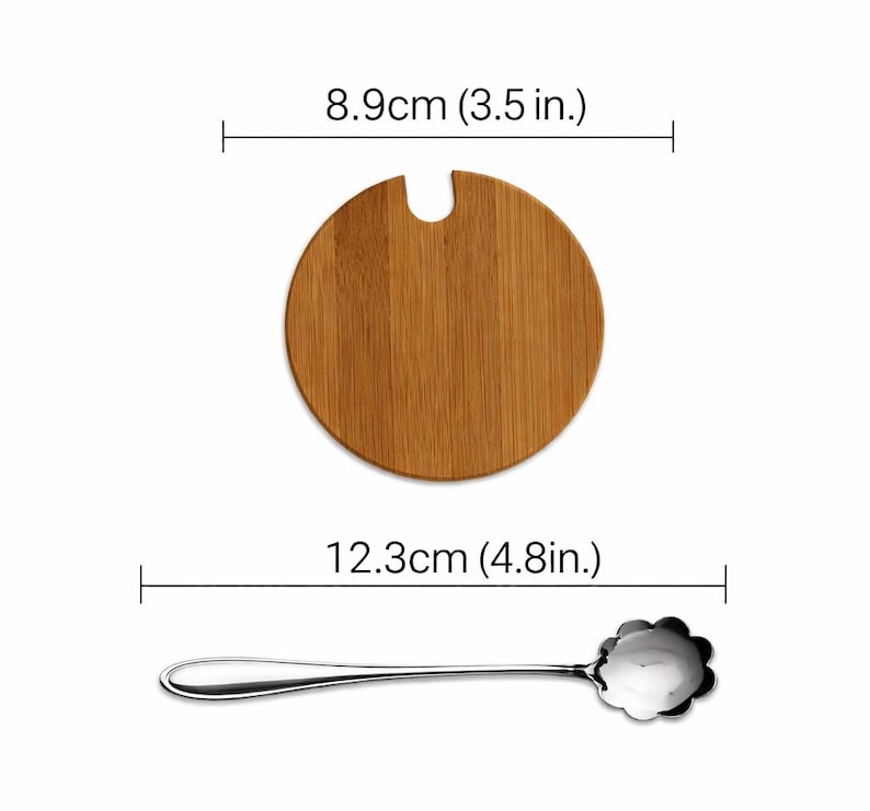 May include: A wooden, round bamboo lid with a notch, measuring 3.5 inches (8.9 cm) in diameter, and a stainless steel spoon with a flower-shaped bowl, 4.8 inches (12.3 cm) long. The spoon has a long, slender handle.
