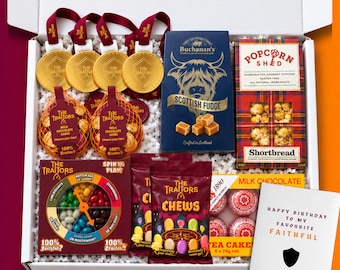 May include: A gift box containing four gold medals with The Traitors branding, two bags of milk chocolate coins, a box of Scottish fudge, a box of Popcorn Shed shortbread, a Traitors spin game, a bag of chews, tea cakes, and a birthday card.
