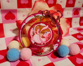 Llavero giratorio de Pokémon con forma de gato psíquico de burbuja rosa y monstruo de bolsillo Mew