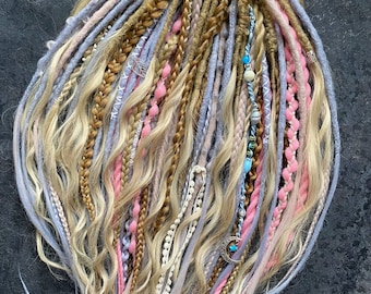 Dreadlocks with curls and braids in pastel shades.
