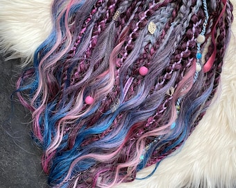 A luxurious set of hand-woven dreadlocks and braids in burgundy, lavender, and teal shades.