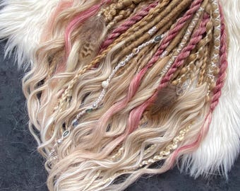 Boho-style dreadlocks with highlights of light and dusty pink. Handcrafted dreadlocks.