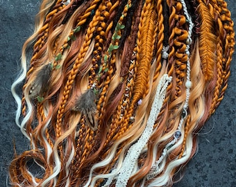 Red dreadlocks in warm copper tones.Fiery boho style.
