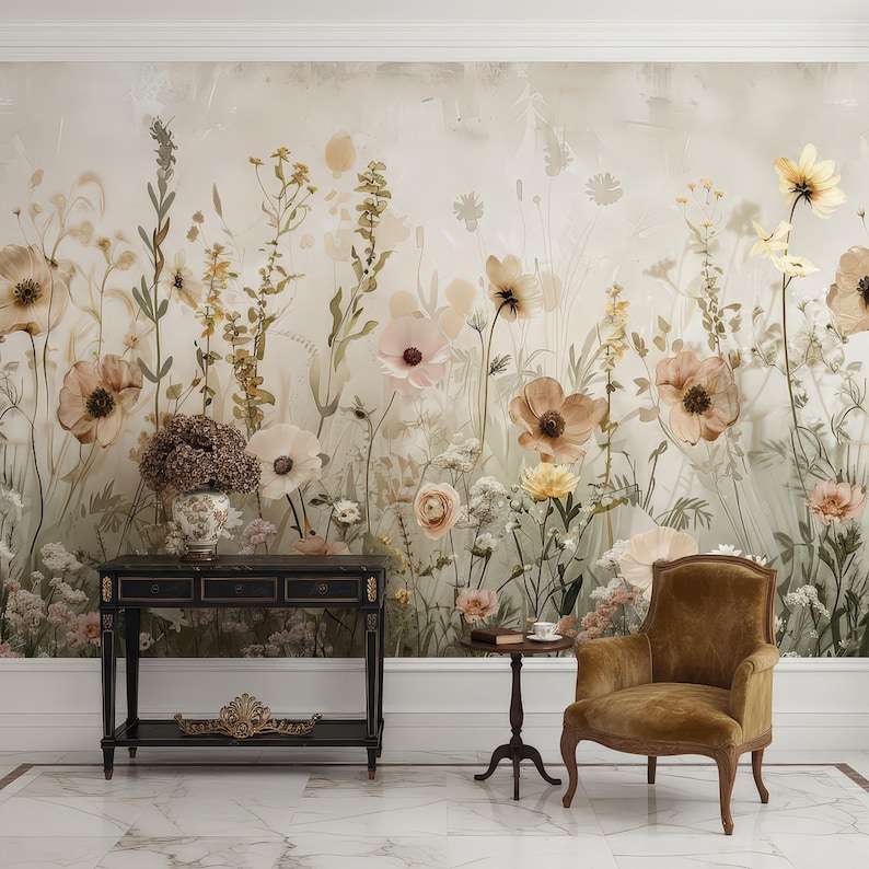 May include: A room with a floral wallpaper featuring large, muted-tone flowers in shades of peach, cream, and yellow. A dark wood console table, small side table, and a brown armchair are in front of the wallpaper. The floor is marble.