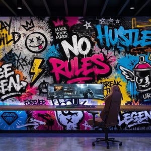 May include: A wall mural featuring vibrant graffiti art with text including "STAY WILD," "MAKE YOUR MARK," "NO RULES," "BE REAL," "HUSTLE," "URBAN," and "LEGEND." The design incorporates a smiley face, a lightning bolt, a winged spray paint can, and diamond icons in bright pink, blue, yellow, and black colors.