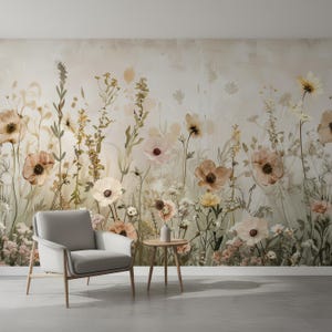 May include: A serene interior scene featuring a floral wallpaper with soft, muted tones of beige, peach, and green. A modern gray armchair and a small wooden side table with a vase are in front of the wallpaper. The room has a minimalist aesthetic.
