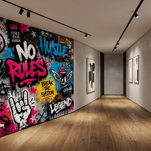 May include: A large wall mural featuring vibrant graffiti art with text including STAY WILD, BE REAL, NO RULES, HUSTLE, BREAK THE SYSTEM, and LEGEND. The design incorporates colorful spray paint elements, a smiley face, a diamond, and a hand gesture.