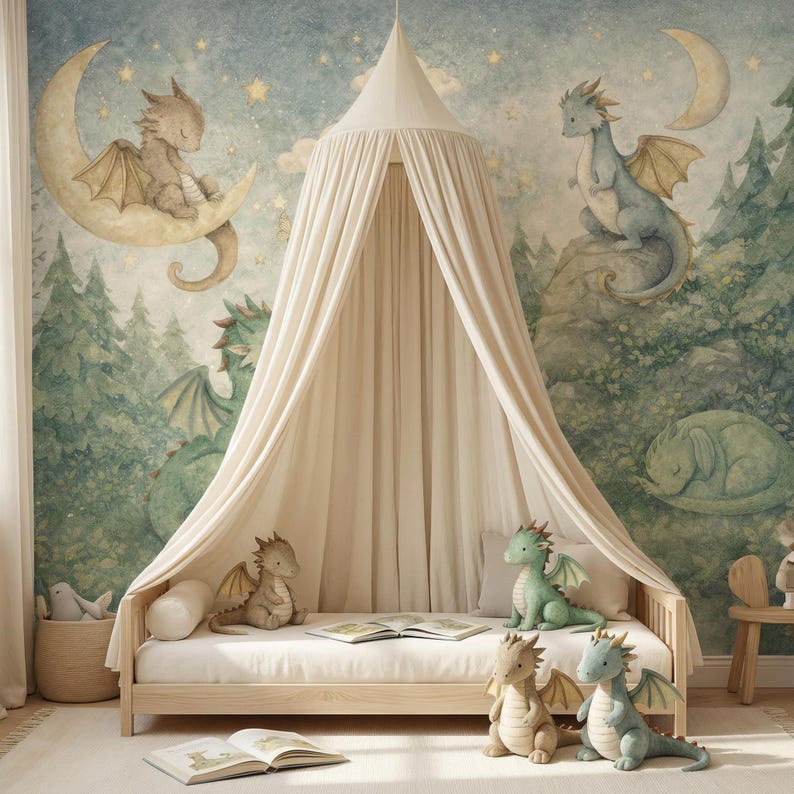 May include: A children's bedroom scene featuring a light wood bed with a cream canopy. The backdrop is a mural with dragons, moons, and stars. Plush dragon toys in various colors are on the bed. A woven basket and open books complete the whimsical decor.