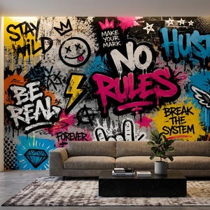 May include: A wall mural featuring vibrant graffiti art with text including "STAY WILD," "MAKE YOUR MARK," "NO RULES," "BE REAL," "BREAK THE SYSTEM," and "URBAN." The design incorporates a smiley face, a lightning bolt, a diamond, and a winged spray paint can.