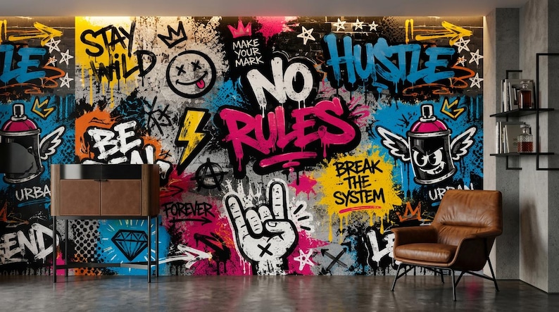 May include: A wall mural featuring vibrant graffiti art with text including "STAY WILD," "MAKE YOUR MARK," "NO RULES," "HUSTLE," "BE REAL," and "BREAK THE SYSTEM." The design incorporates a smiley face, a hand gesture, and spray paint cans.