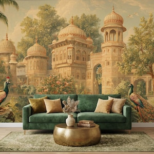 May include: A detailed mural depicting an Indian palace with ornate architecture, lush greenery, and two peacocks. A green velvet sofa with throw pillows and a gold coffee table complete the scene. The overall theme is luxury and travel.