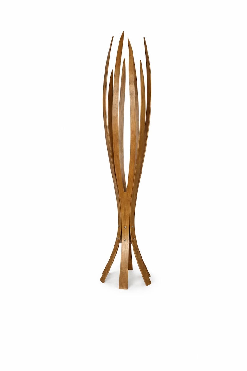 May include: A tall, wooden coat stand with a distinctive design. It features multiple curved wooden slats that extend upwards, creating a decorative and functional piece. The natural wood finish adds warmth and style to any room.