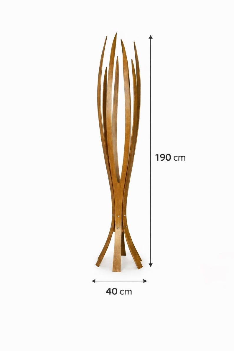 May include: A tall wooden coat rack with a distinctive design. The rack is 190 cm tall and 40 cm wide at the base. It features multiple curved wooden slats that extend upwards, creating a decorative and functional piece for any entryway or room.