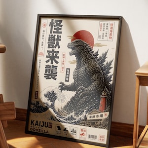 May include: A framed poster featuring a large, dark, textured monster standing in a turbulent ocean with a red sun in the background. The artwork includes a lighthouse, a small boat, and Japanese text characters, with the word KAIJU and GODZILLA at the bottom.