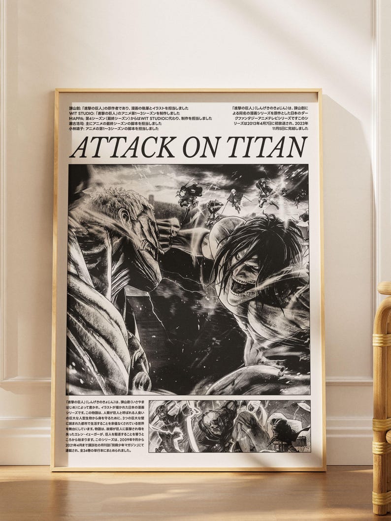 May include: Framed black and white Attack on Titan poster. The artwork features two large figures in a battle scene, with the title "ATTACK ON TITAN" in bold letters. The poster is in a wooden frame.