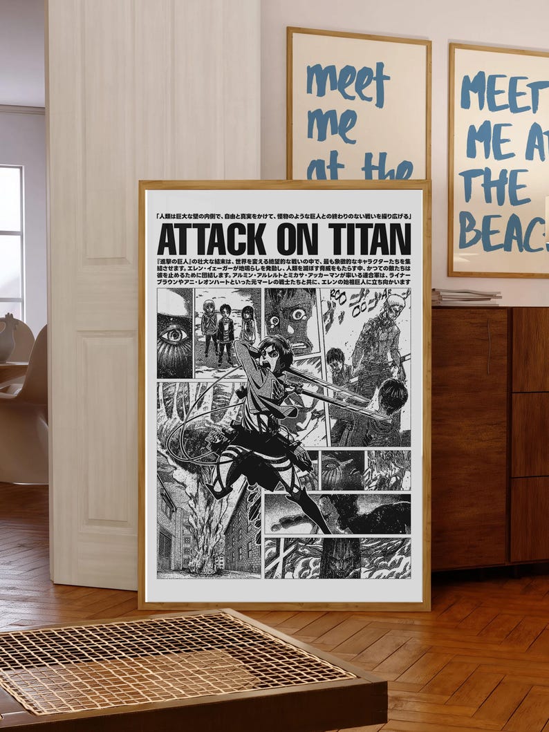 May include: A rectangular poster featuring black and white manga panels from Attack on Titan. The design includes Japanese text at the top, a central action scene of a character in gear, and various smaller panels depicting characters and city scenes.
