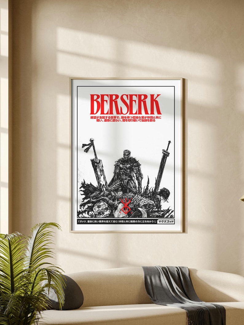 May include: A framed black and white poster with the word "BERSERK" in red. The poster features a detailed illustration of a warrior figure with swords and other figures. Japanese text is also present.