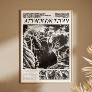 May include: A framed black and white Attack on Titan poster. The artwork depicts a battle scene with figures in the foreground and background. The title "ATTACK ON TITAN" is prominently displayed in bold letters.