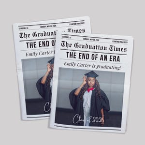 May include: Two newspapers titled "The Graduation Times" with the headline "THE END OF AN ERA." The newspapers feature a photo of a graduate in a cap and gown. The text reads "Emily Carter is graduating!" and "Class of 2026."