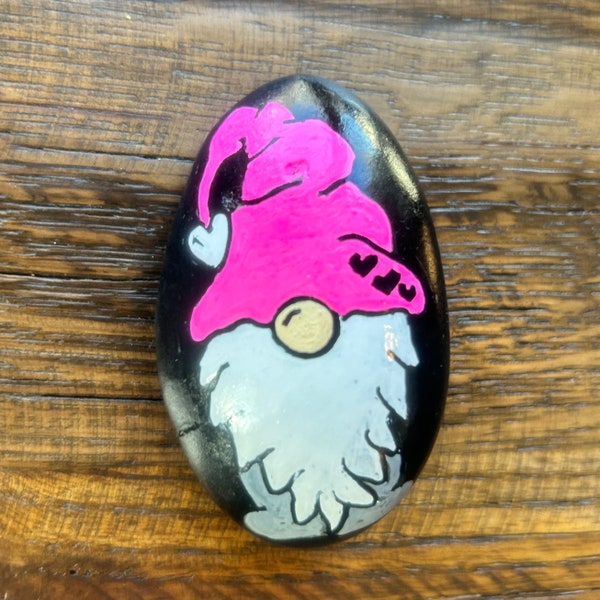 Hand painted gnome rock with inspirational saying on the back.