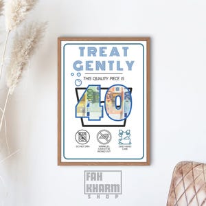 May include: A framed art print with the text "TREAT GENTLY" and "THIS QUALITY PIECE IS". The artwork features the number "40" made of Euro banknotes. Includes care instructions: do not spin, wrinkles cannot be ironed out, and daily hand care.