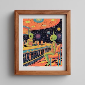 May include: A framed print depicts two green aliens at a bar in space. The bar is brightly lit with orange and blue hues, and the background shows planets and stars. The aliens are enjoying drinks, creating a whimsical and colorful scene.