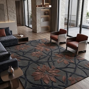 Puede incluir: Una alfombra rectangular con fondo gris oscuro y un patrón floral texturizado en relieve en tonos cobre y marrón. El diseño consiste en grandes flores estilizadas conectadas por líneas oscuras que se asemejan a enredaderas.