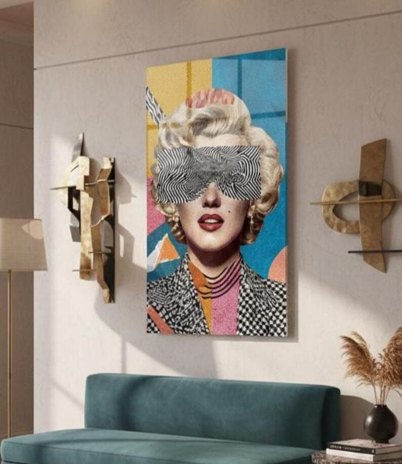 May include: A vertical glass wall art featuring a retro blonde woman portrait with black-and-white zebra pattern sunglasses, red lips, and a colorful geometric background.