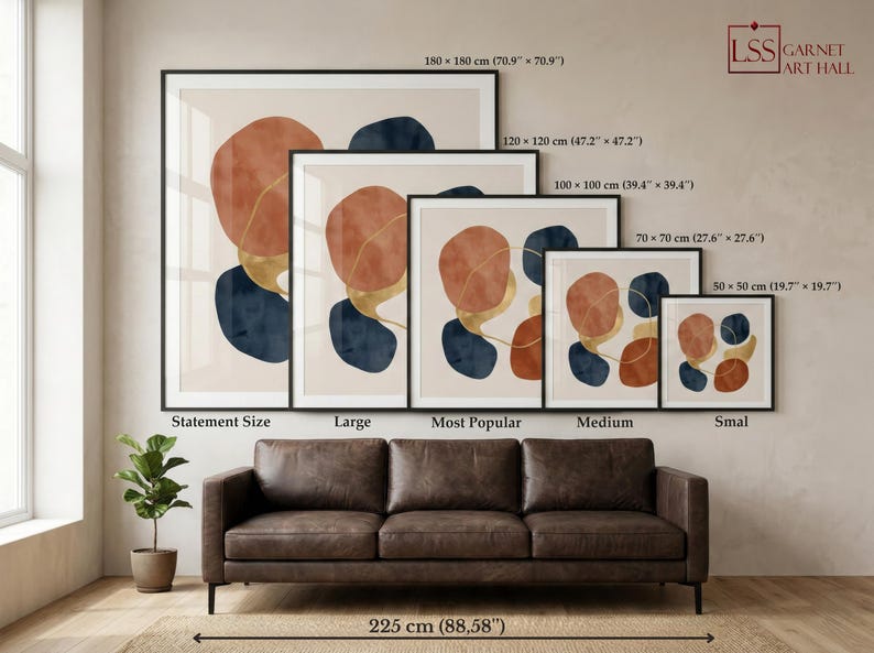 May include: A display of framed abstract art prints in various sizes, including 180 x 180 cm (70.9" x 70.9"), 120 x 120 cm (47.2" x 47.2"), 100 x 100 cm (39.4" x 39.4"), 70 x 70 cm (27.6" x 27.6"), and 50 x 50 cm (19.7" x 19.7"). The art features orange, blue, and gold shapes.