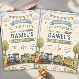 May include: Two identical birthday invitation cards featuring a watercolor train theme. The text reads ALL ABOARD! LET'S CELEBRATE DANIEL'S 2ND BIRTHDAY! with event details including Saturday May 17 at 2:00 PM at The Station, 1213 Railroad Lane, Austin, Texas.