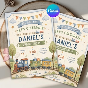 May include: Two rectangular birthday invitation cards featuring a watercolor train theme. The text reads ALL ABOARD! LET'S CELEBRATE DANIEL'S 2ND BIRTHDAY! with event details including date, time, and location. A blue, green, and yellow train travels on tracks.