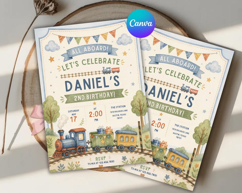 May include: Two rectangular birthday invitation cards featuring a watercolor train theme. The text reads ALL ABOARD! LET'S CELEBRATE DANIEL'S 2ND BIRTHDAY! with event details including date, time, and location. A blue, green, and yellow train travels on tracks.