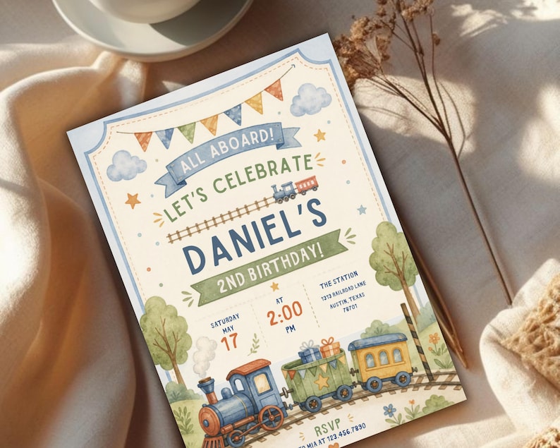 May include: A rectangular birthday invitation card featuring a watercolor train theme. The text reads ALL ABOARD! LET'S CELEBRATE DANIEL'S 2ND BIRTHDAY! with event details including the date, time, and location. The design includes a train, bunting, and trees.