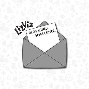 May include: A gray envelope with a white card inside. The card has the text "Dear Santa, send coffee." written on it.