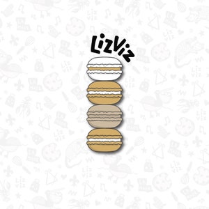 Puede incluir: Una pila de cuatro macarons con rellenos de diferentes colores. Los macarons están dispuestos en una torre con el texto "LizViz" encima.