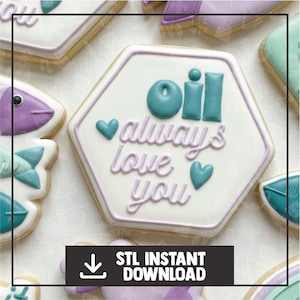 May include: A collection of decorated sugar cookies. The central cookie is a white hexagon with teal text that reads "oil always love you" and teal hearts. The cookies are surrounded by other cookies with various designs and colors. The image also includes the text "STL INSTANT DOWNLOAD".