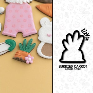 May include: A black cookie cutter shaped like a bunny with a carrot sticking out of its head. The cutter is labeled "Burried Carrot Cookie Cutter" and "Lizviz".