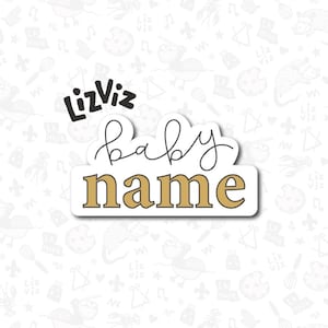 May include: A white sticker with black text that says "LizViz baby name" in a cursive font. The text is on a gold background.