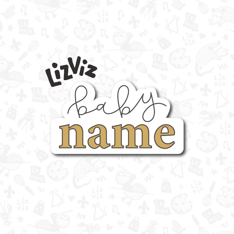 May include: A white sticker with black text that says "LizViz baby name" in a cursive font. The text is on a gold background.