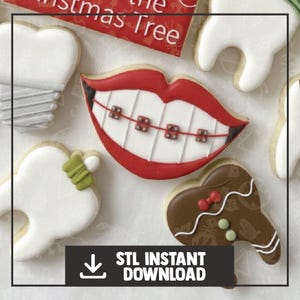 May include: Assortment of decorated cookies, including a mouth with braces, teeth, and a gingerbread tooth. The cookies are white, red, brown, and green. The image includes the text "STL INSTANT DOWNLOAD".
